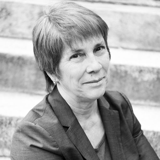 Black and white photo of Annie LaCourt in front of steps